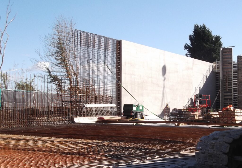 water tank construction showing exposed rebar