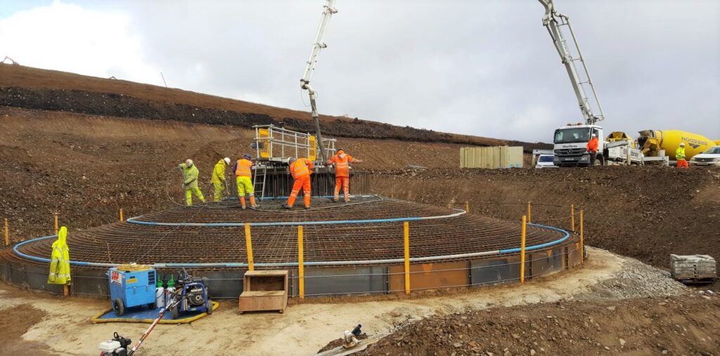 Construction of wind turbine base showing concrete and steel fixing Dorenell Wind Farm