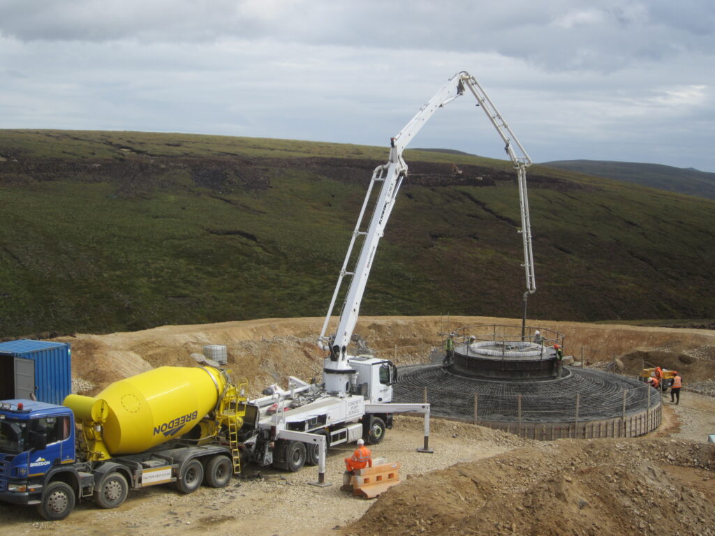 Construction of wind turbine base showing concrete and steel fixing Dorenell Wind Farm